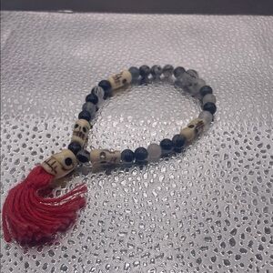 TOURMALATED QUARTZ AND BONE
WRIST MALA